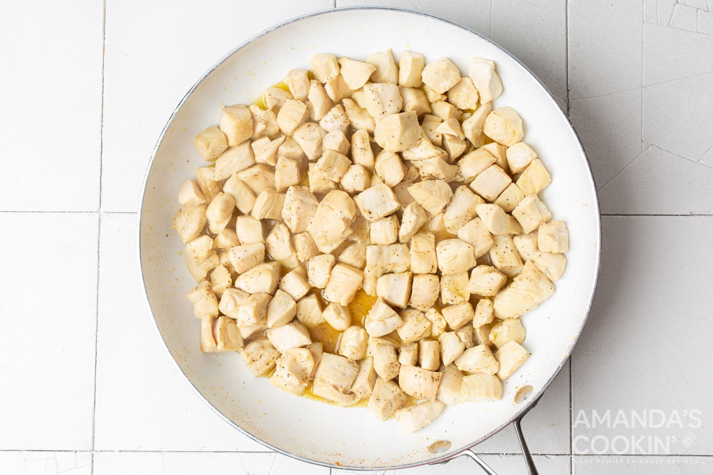cubed chicken in a skillet