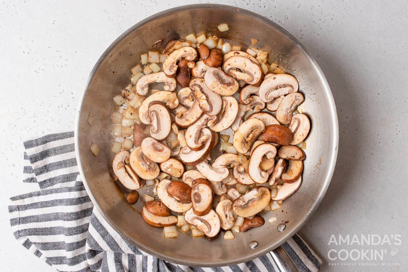 mushrooms and onions in a skillet