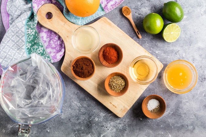 ingredients for chicken tacos laid out on cutting board