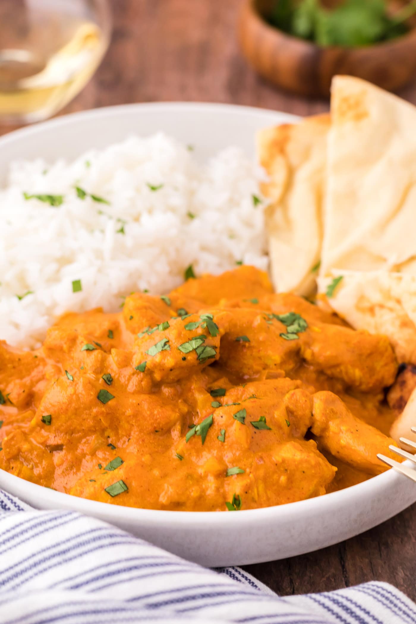 Close up of a bowl of Chicken Tikka Masala with rice