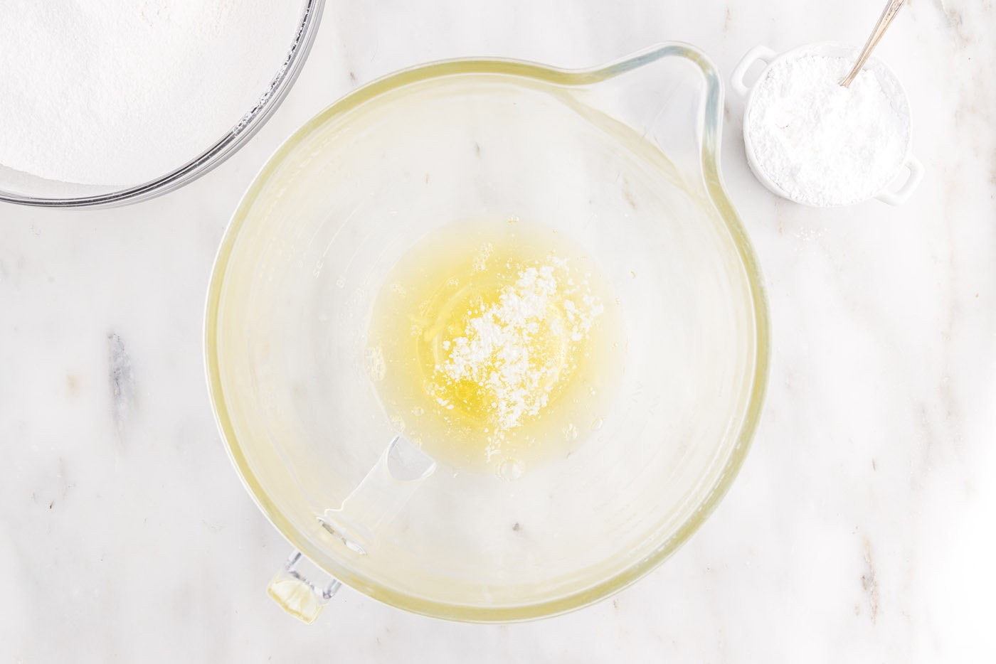 egg whites and cream of tartar in stand mixer bowl