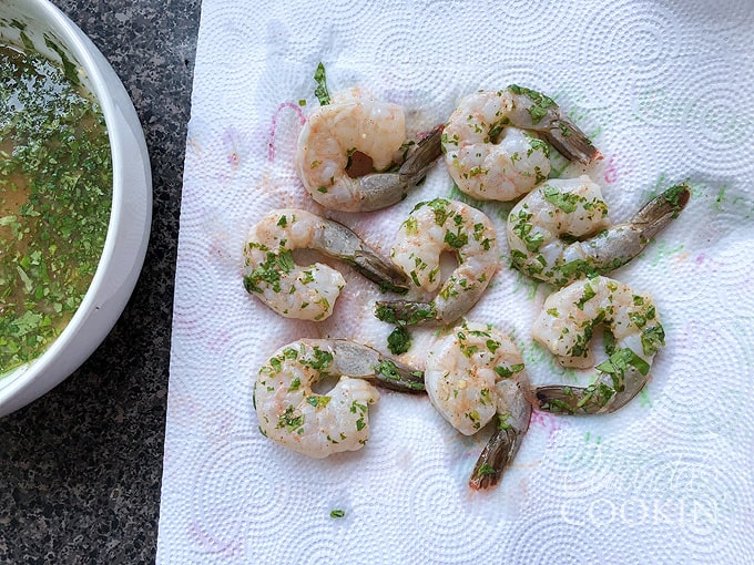 drain marinated shrimp on paper towels