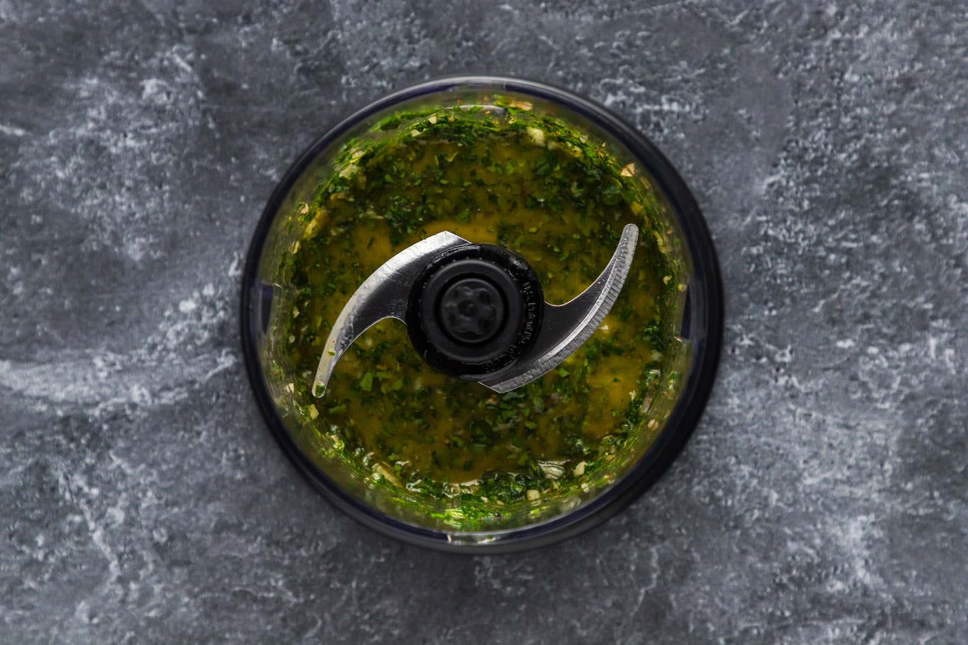blitzed chimichurri ingredients in a mini food chopper
