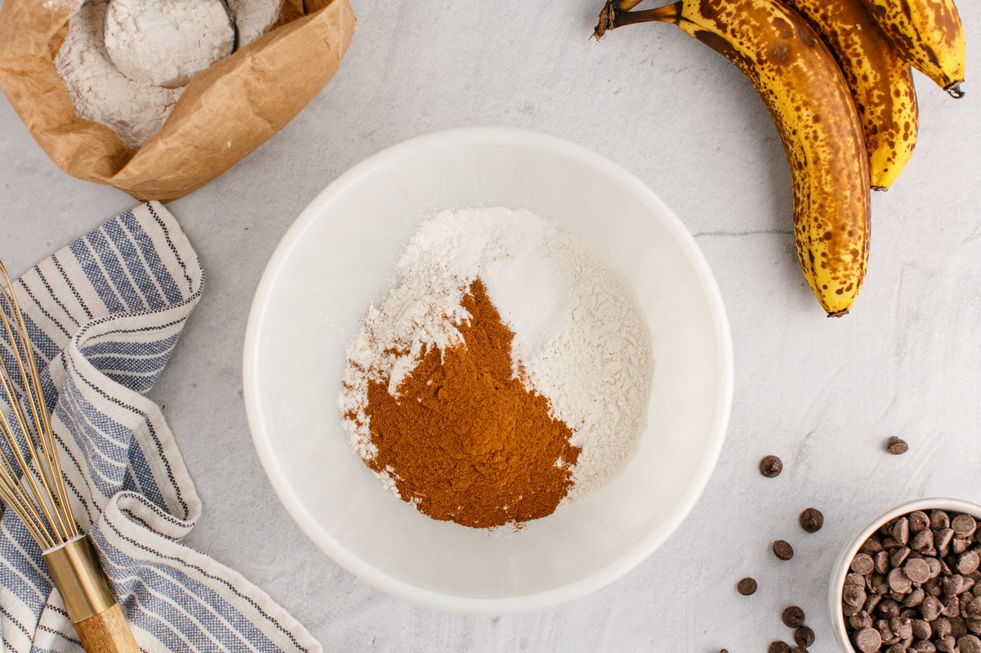cinnamon, flour, baking soda, baking powder, and salt in a bowl