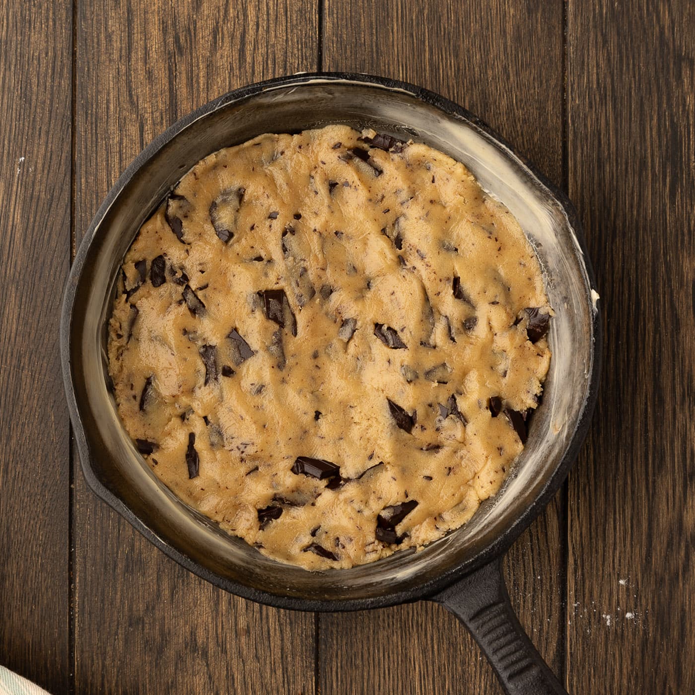 chocolate chip cookie dough pressed into a skillet
