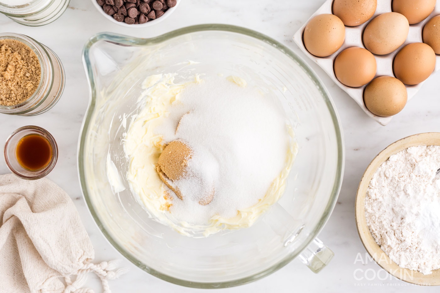 white and brown sugar in a mixing bowl with butter