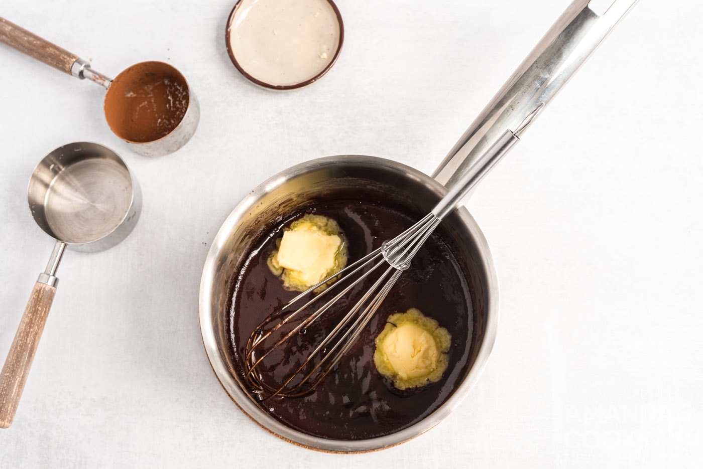 whisking butter in chocolate