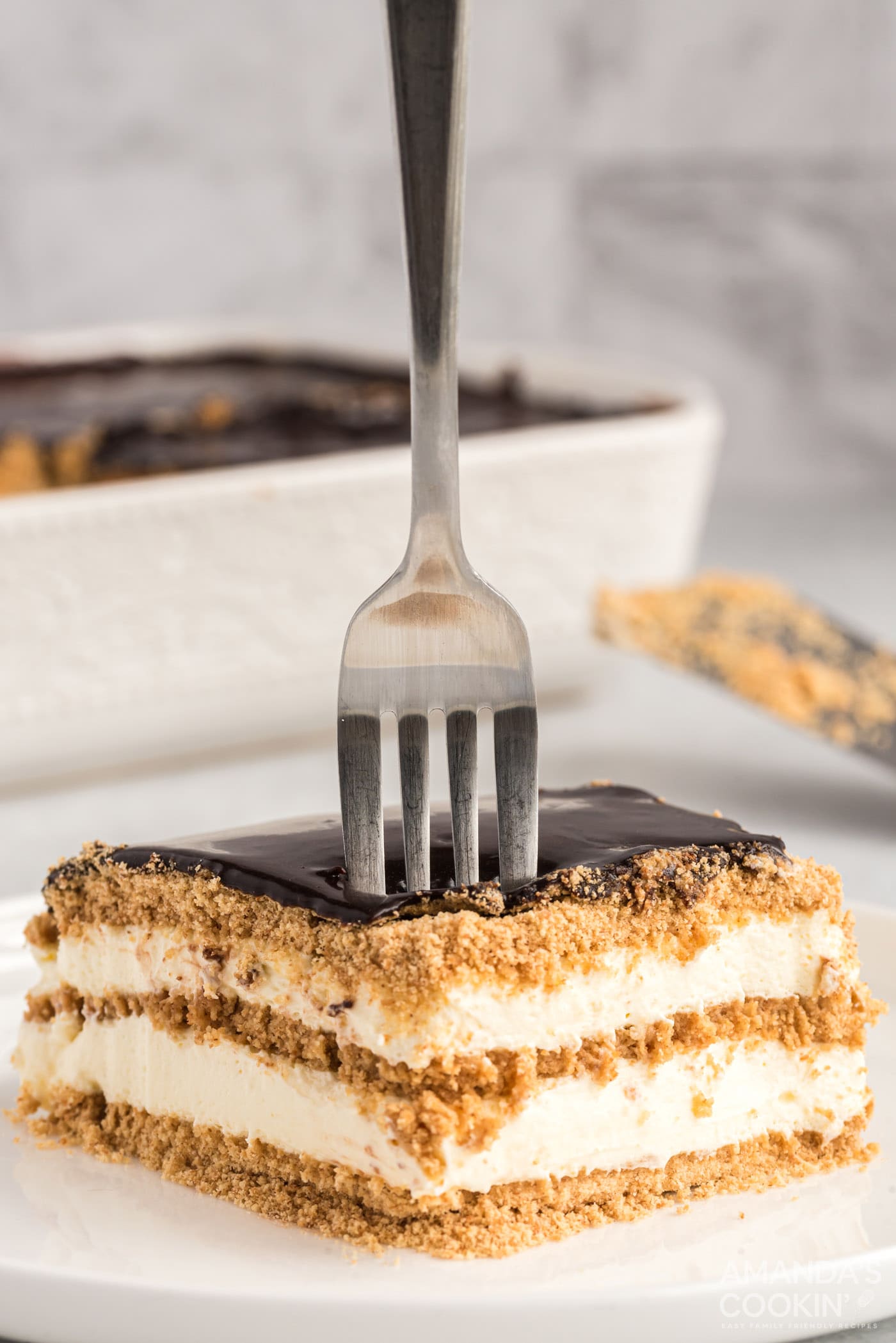 fork stuck into eclair cake