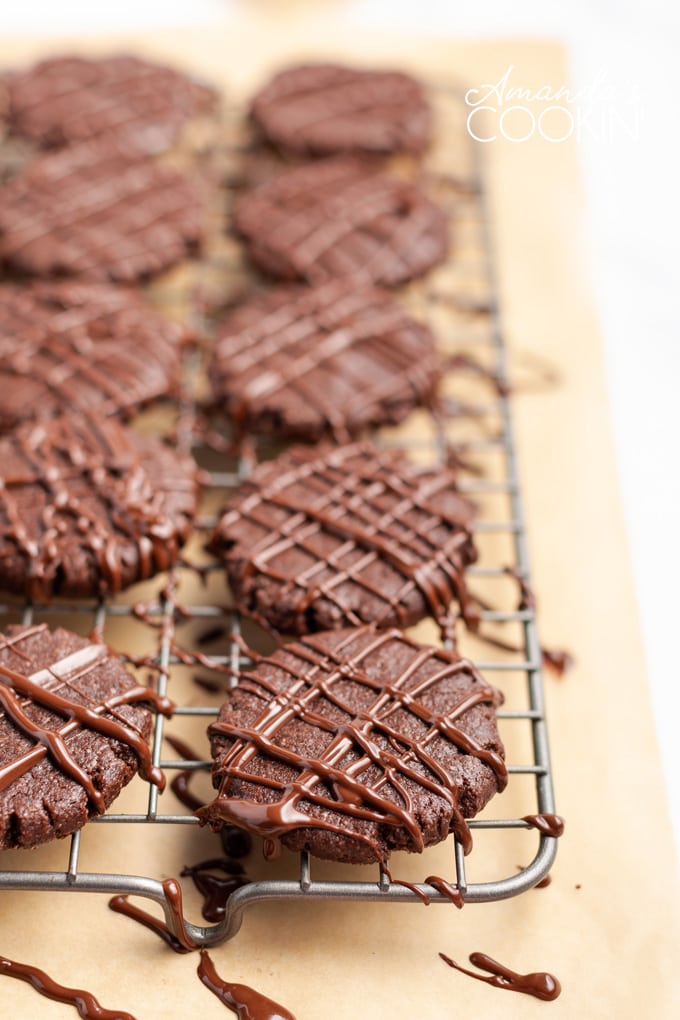 wire rack of chocolate mint cookies drizzled with melted chocolate