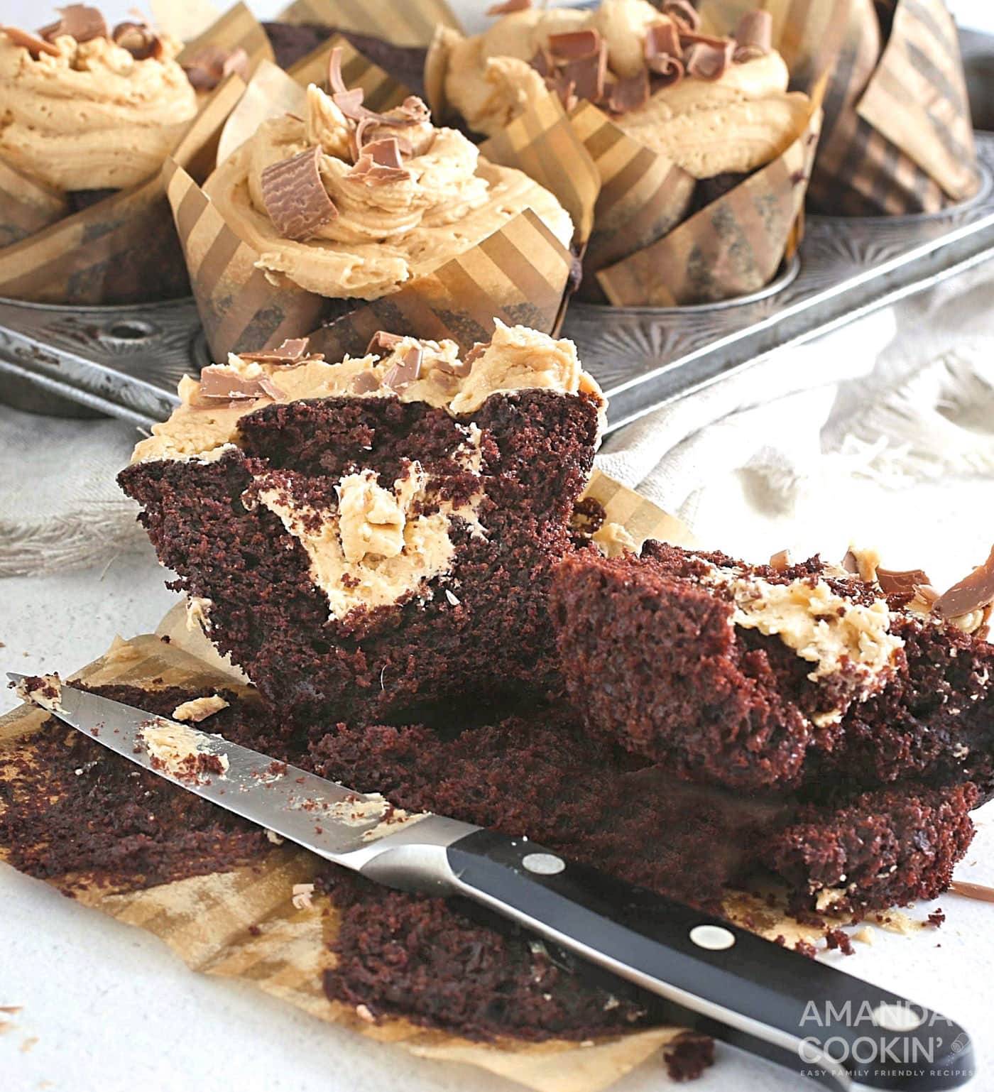 Chocolate Peanut Butter Cupcake cut open to reveal peanut butter filling