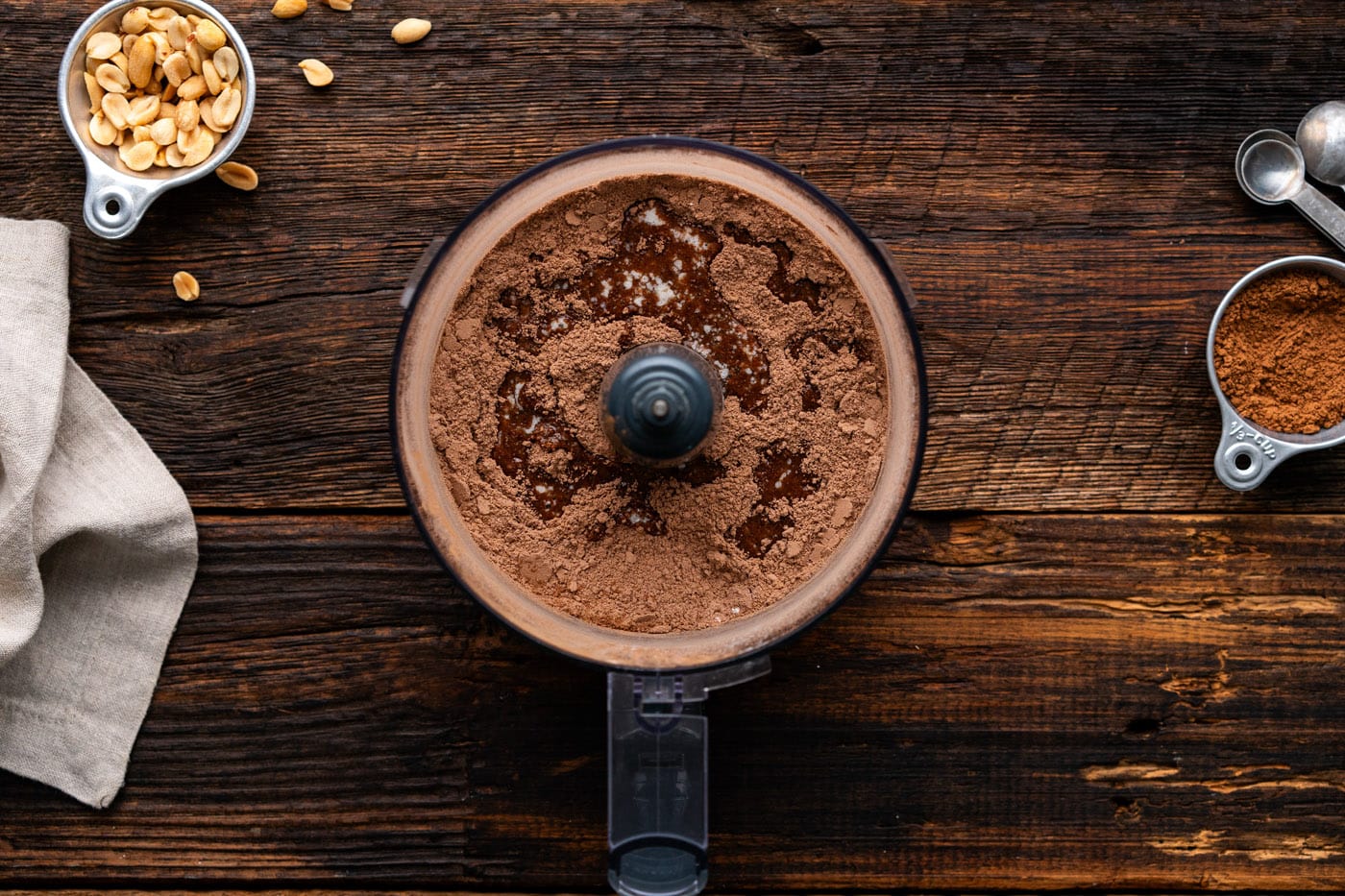 graham cracker crumbs pulsed with cocoa powder, sugar, and melted butter in a food processor
