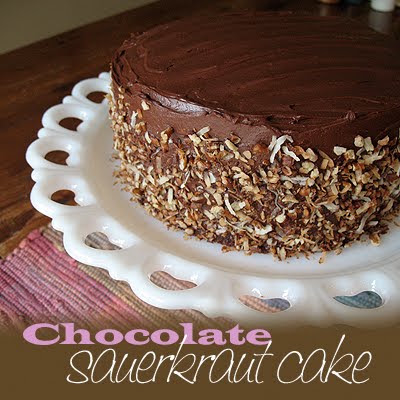 A photo of a chocolate sauerkraut cake on a white cake stand.