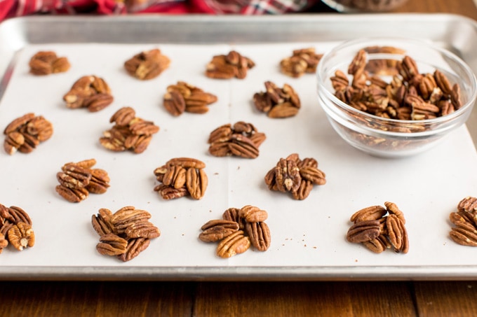 mounds of pecans on baking sheet