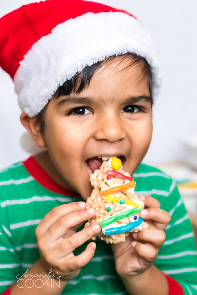 little boy eating a Christmas Tree Rice Krispie Treat
