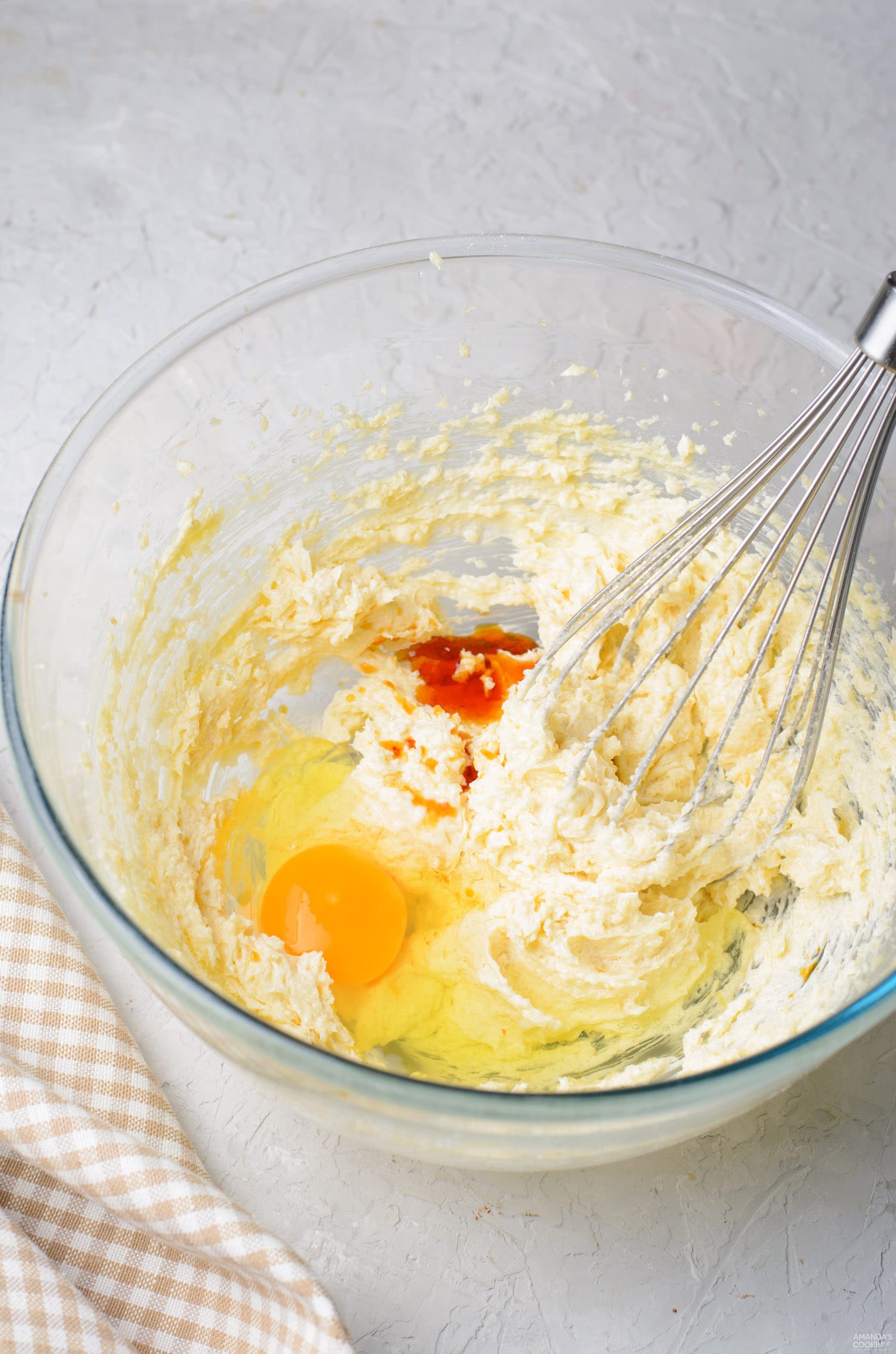 mixing egg into flour mixture
