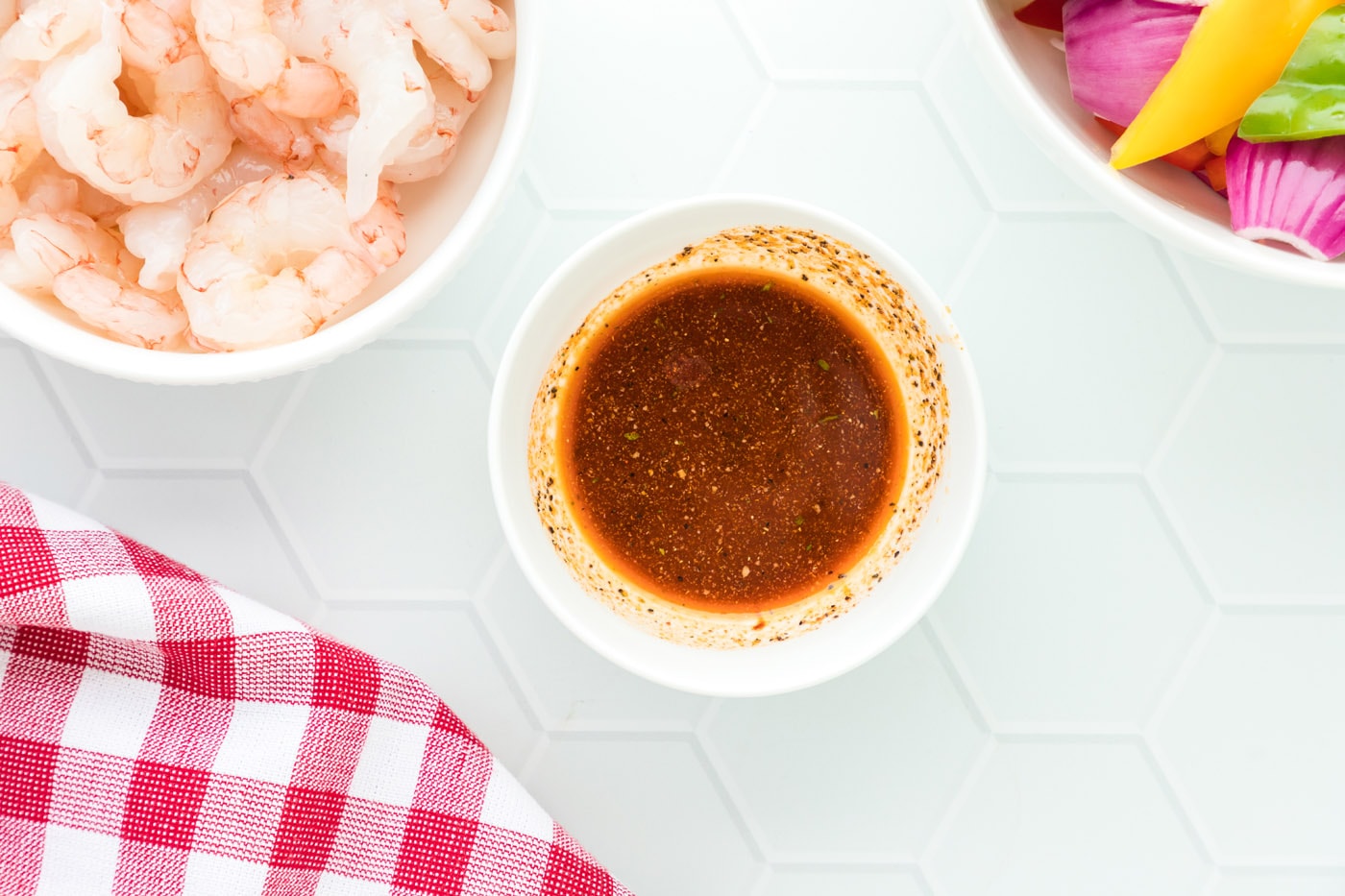 olive oil, cayenne pepper, black pepper, and garlic salt in a bowl