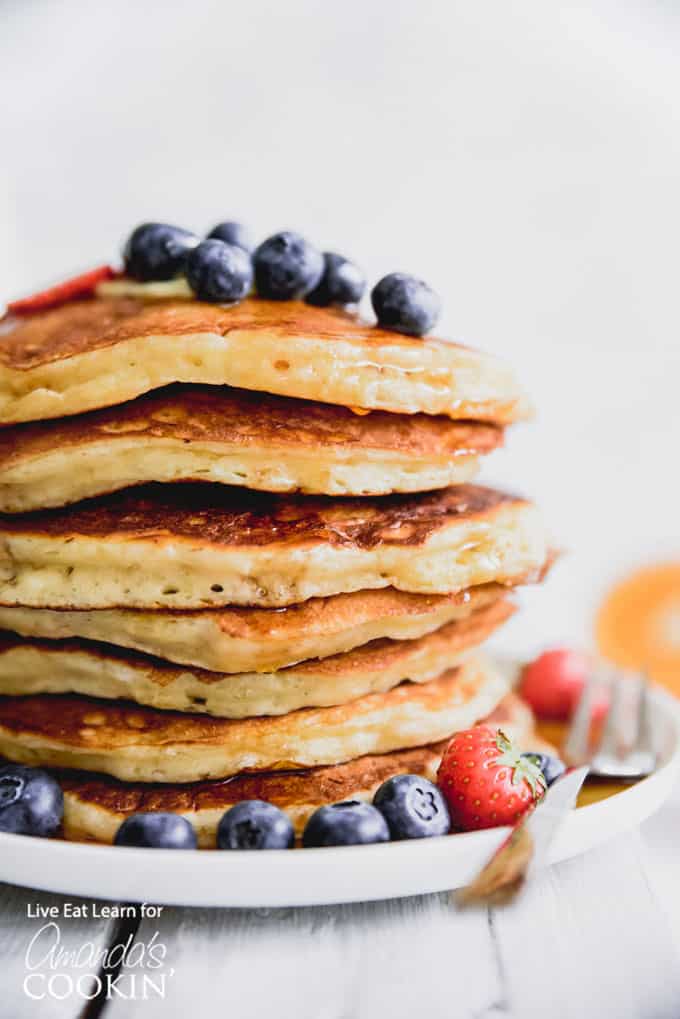 Fluffy buttermilk pancakes with blueberries and strawberries