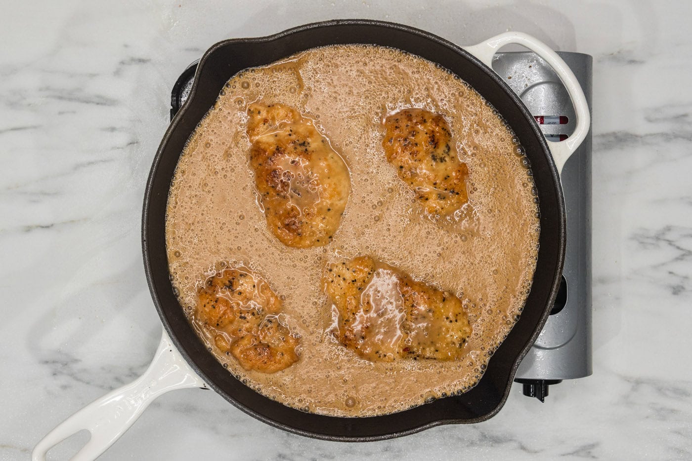 coconut chicken in a skillet