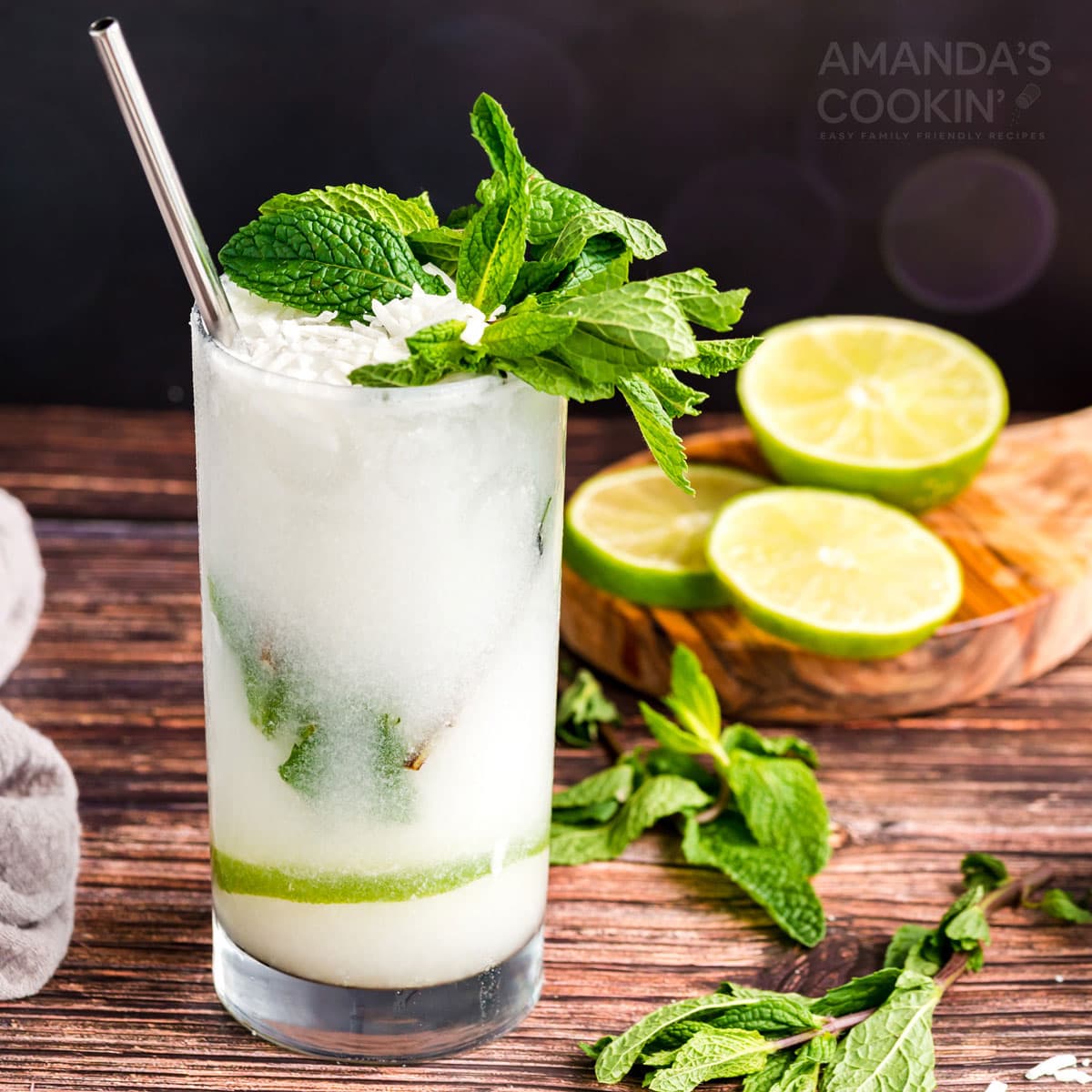 coconut mojito with limes in the background