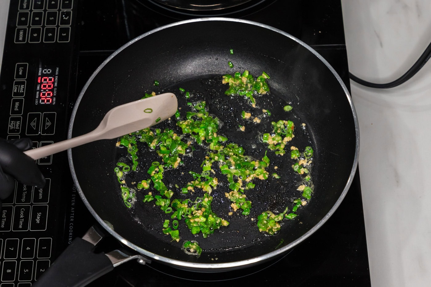 sauteeing garlic and sliced green onion