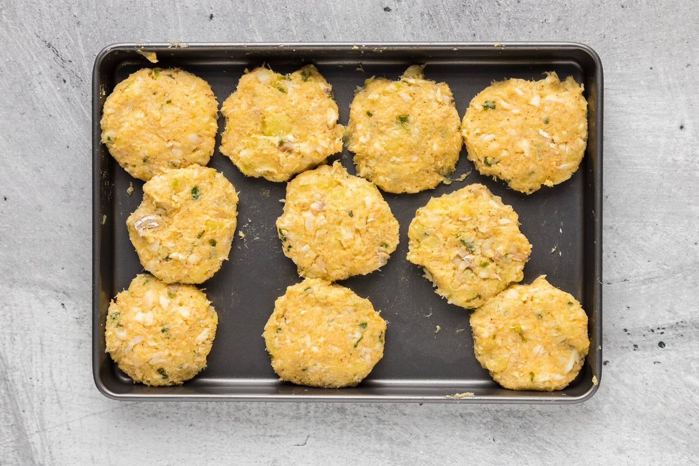 cod fish patties on a baking sheet