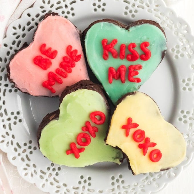 heart shaped decorated brownies on a plate