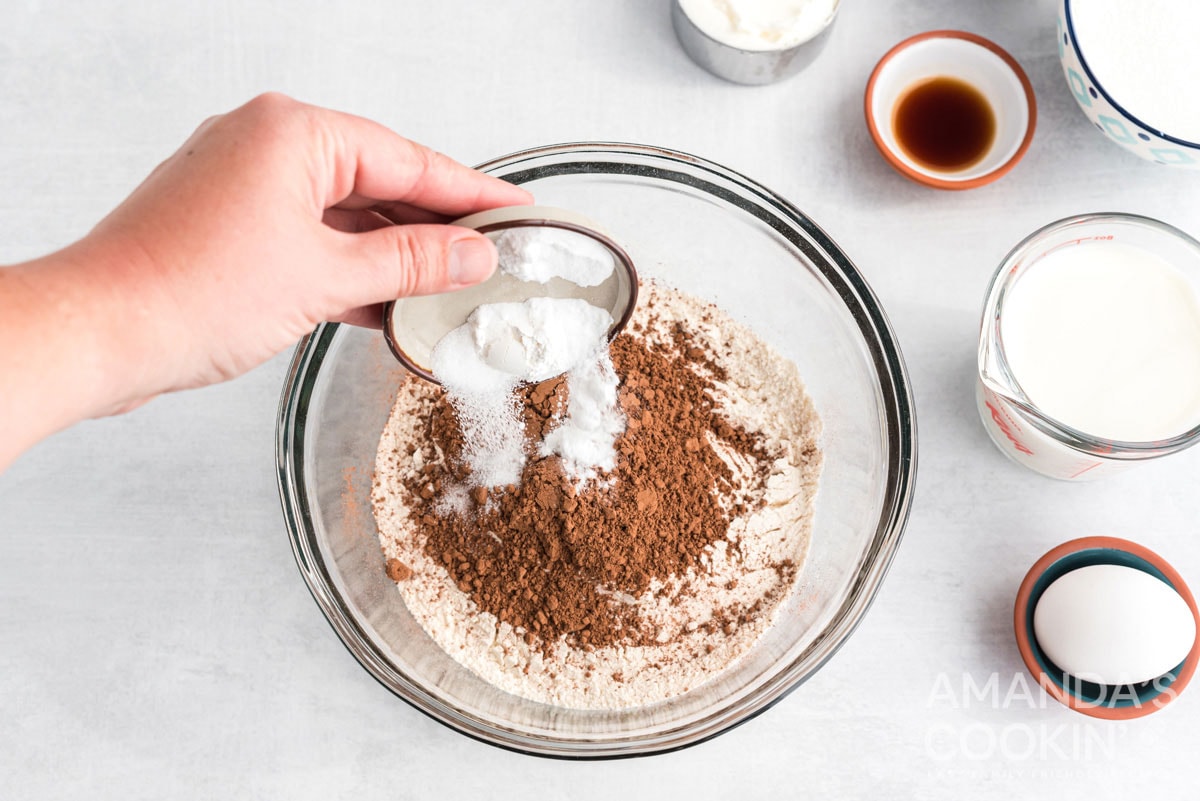 adding baking soda to bowl