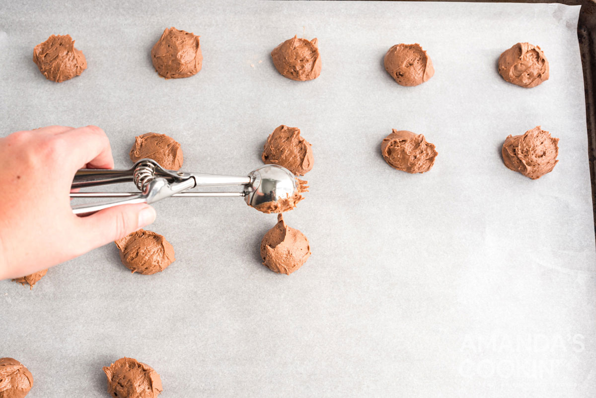 scooping dough onto cookie sheet