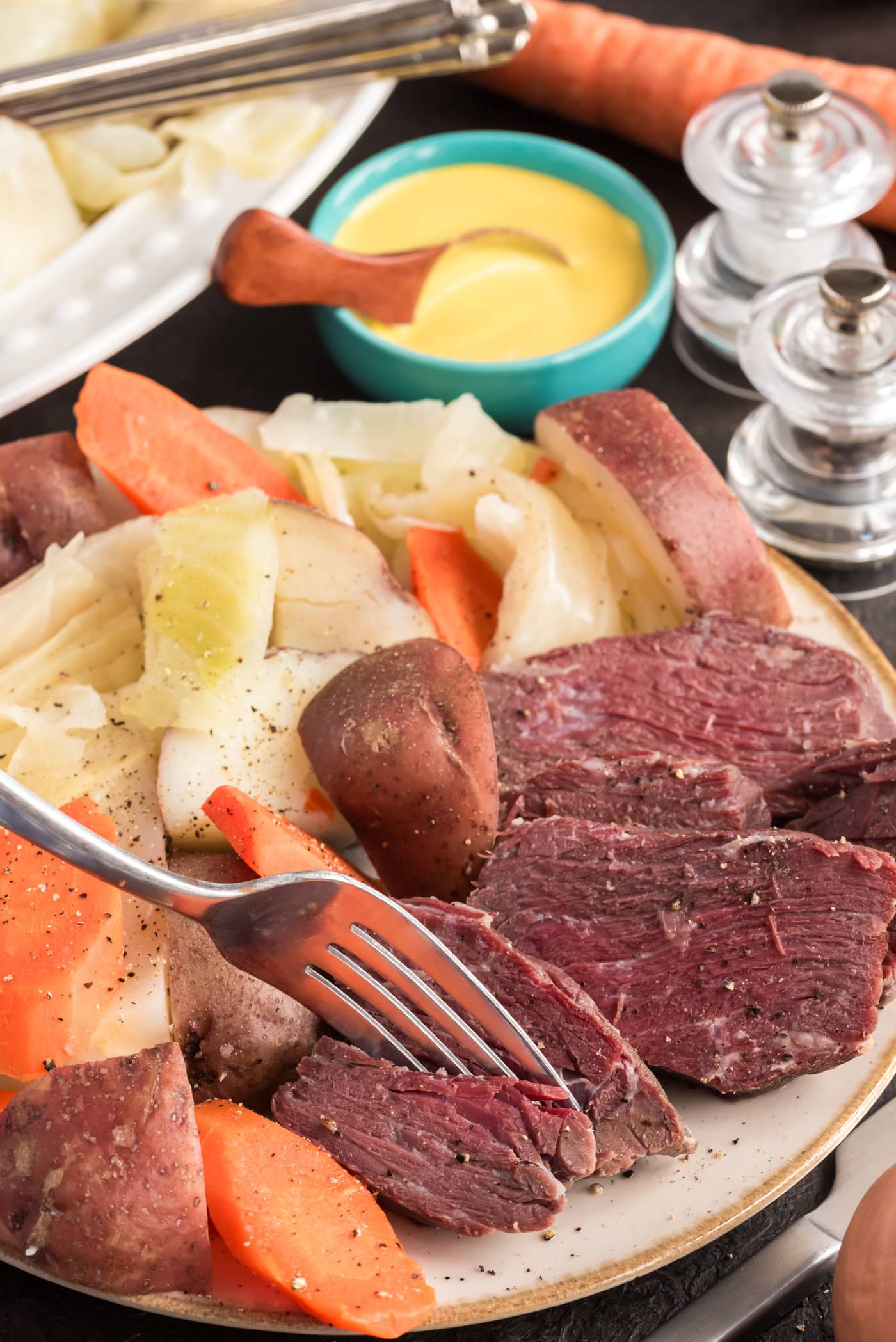 Fork breaking up a piece of Corned Beef