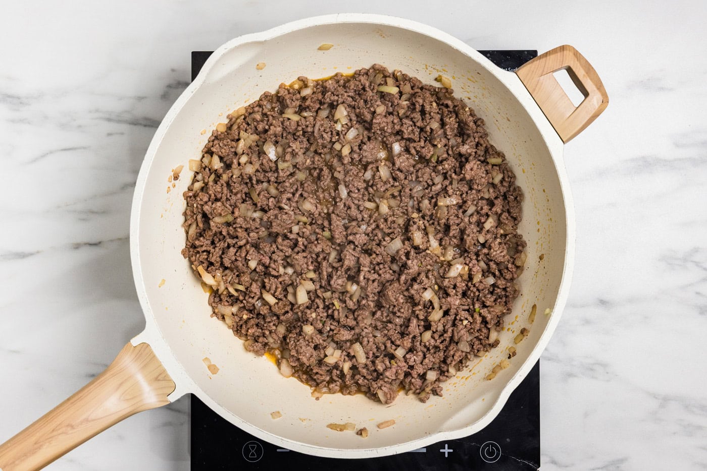 cooked ground beef in skillet