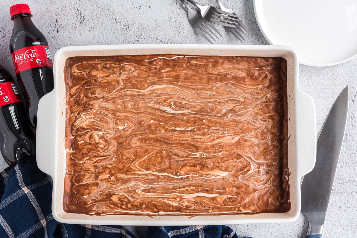 marshmallow and chocolate frosting on coke cake