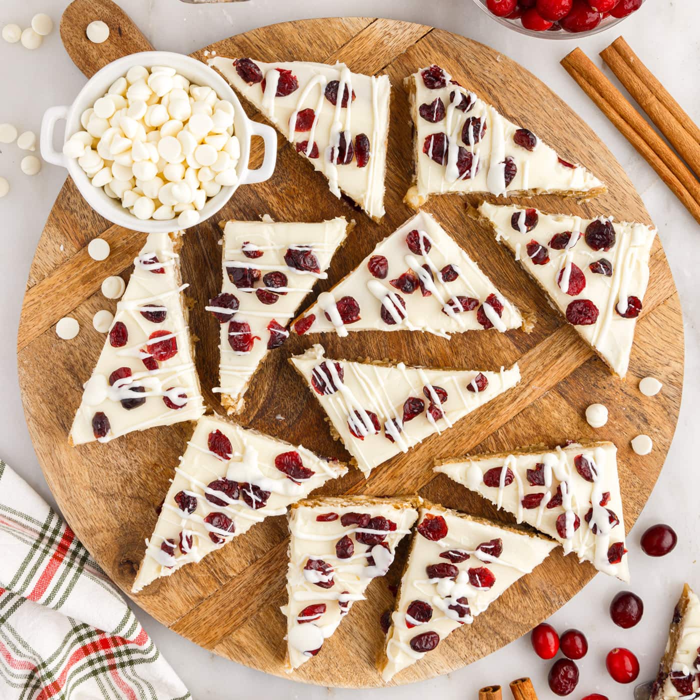 Cranberry Bliss Bars on a wooden serving platter