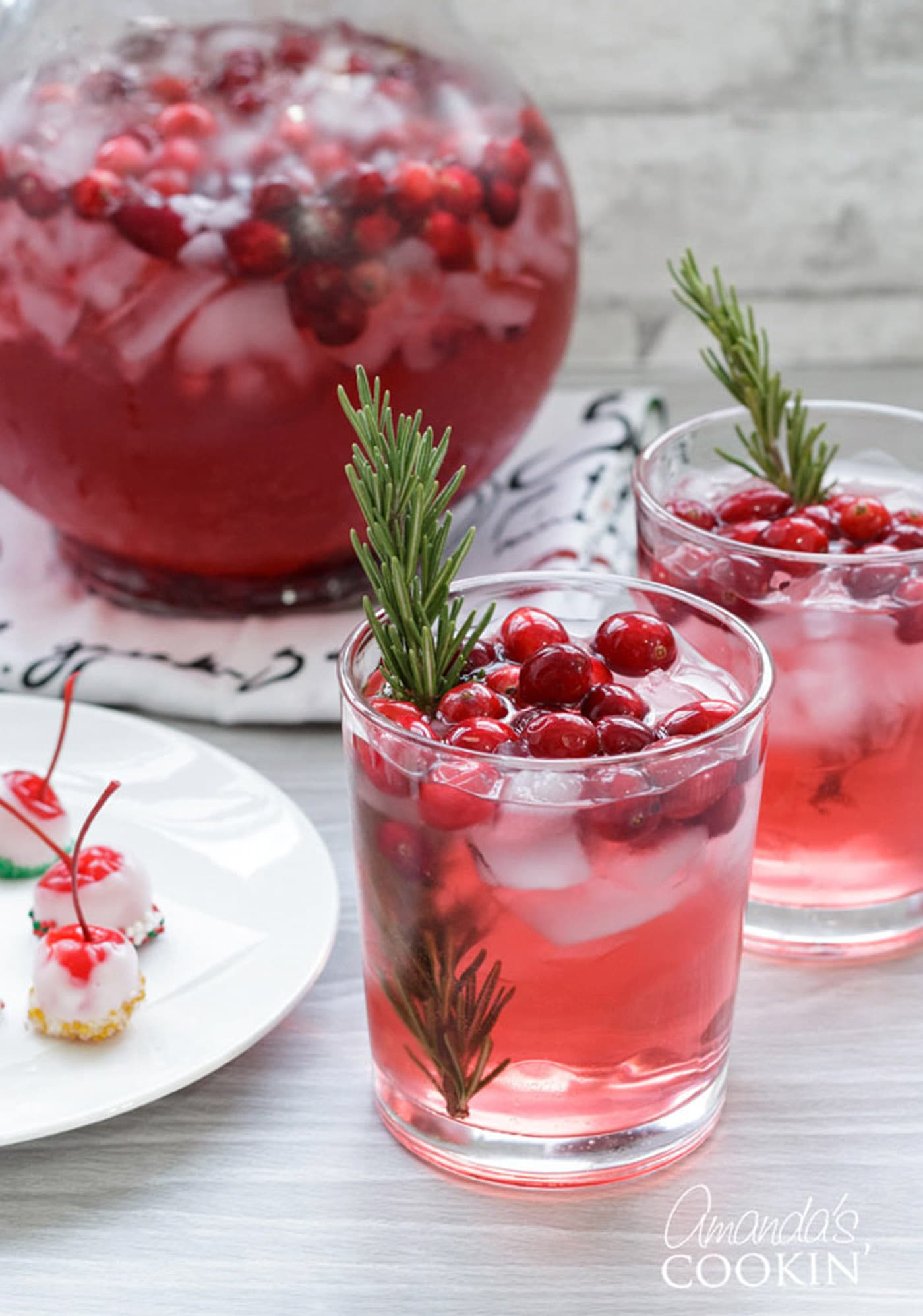 two glasses and a pitcher of holiday punch