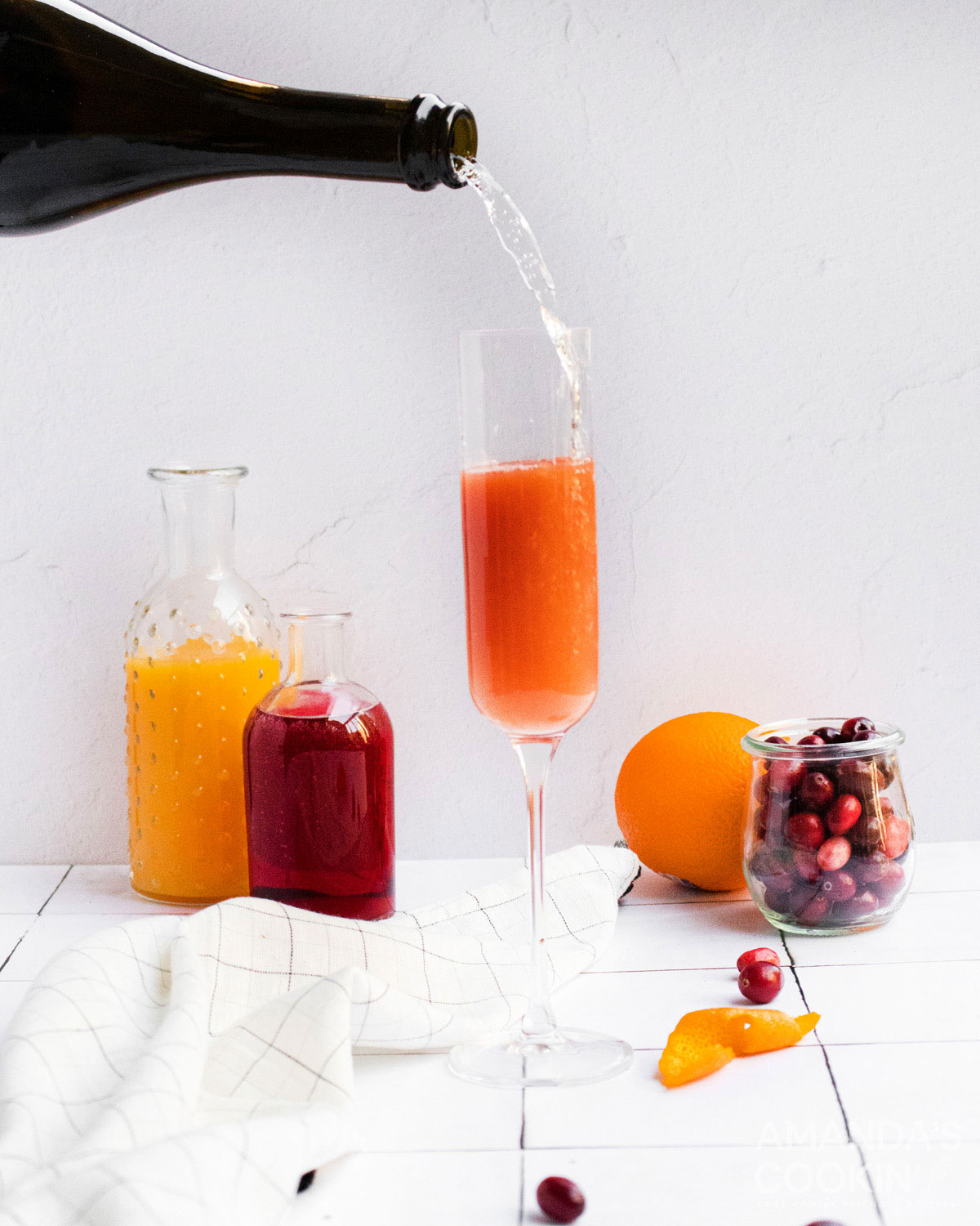 pouring sparkling wine into a chamagne flute