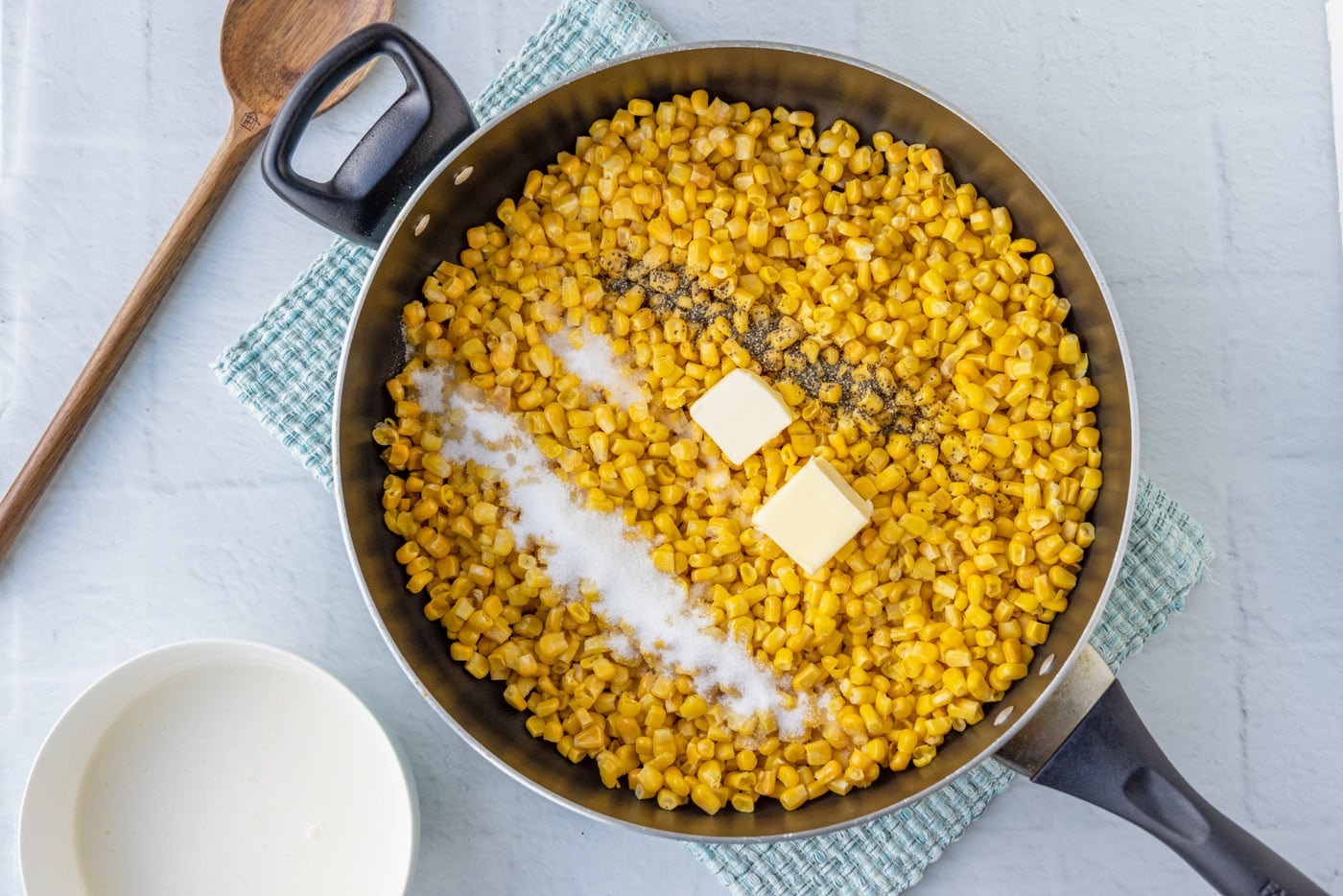 corn, butter, salt, and pepper in a skillet