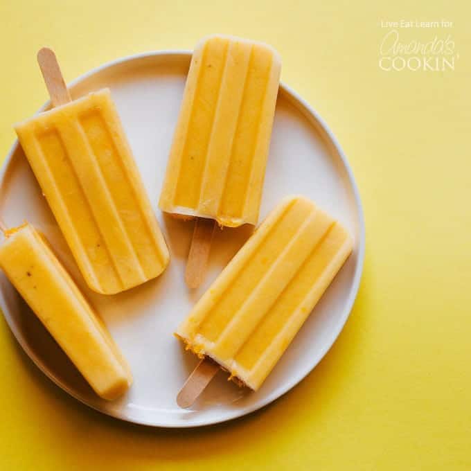 4 popsicles on a white plate