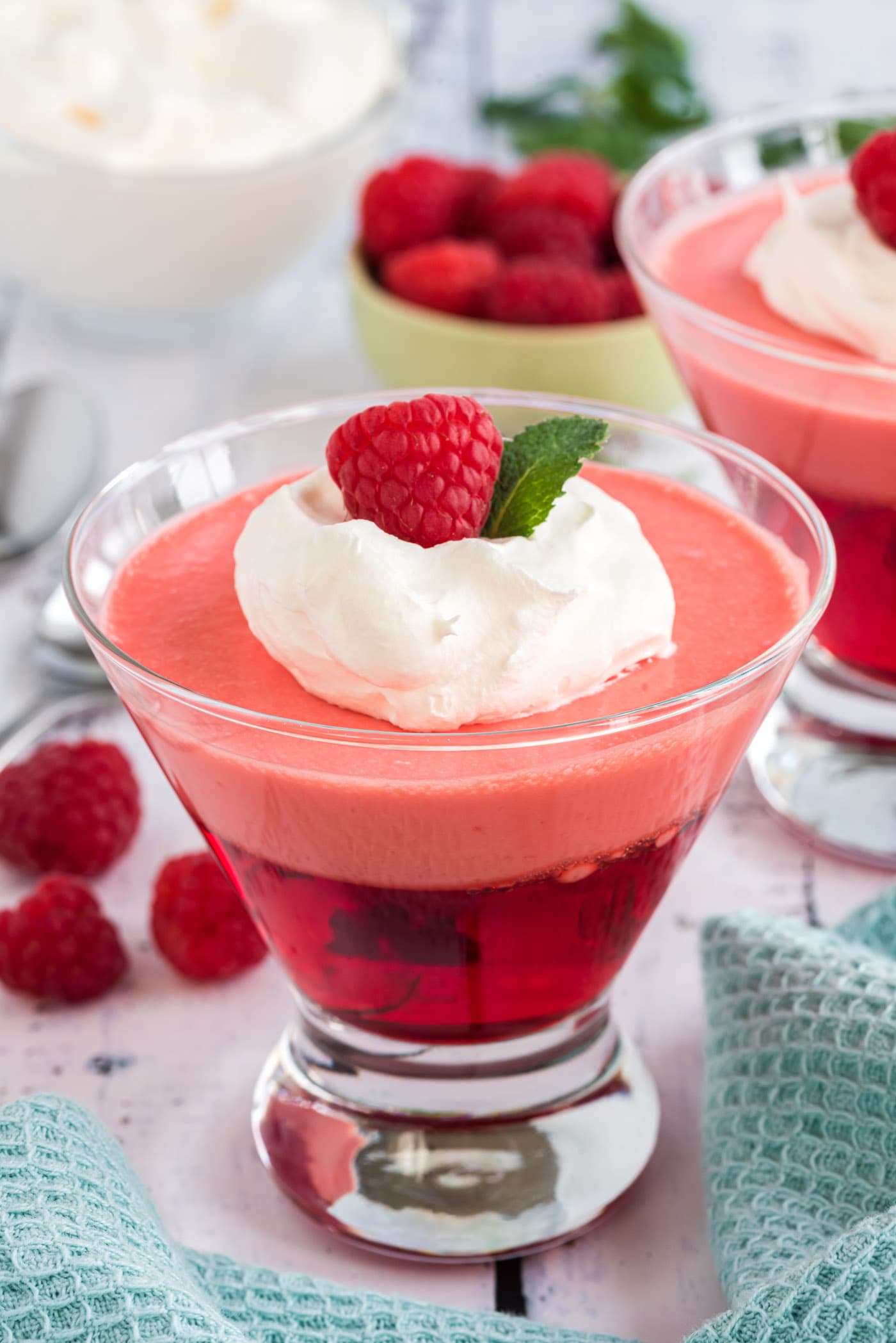Raspberry Jell-O Parfaits with a raspberry garnish