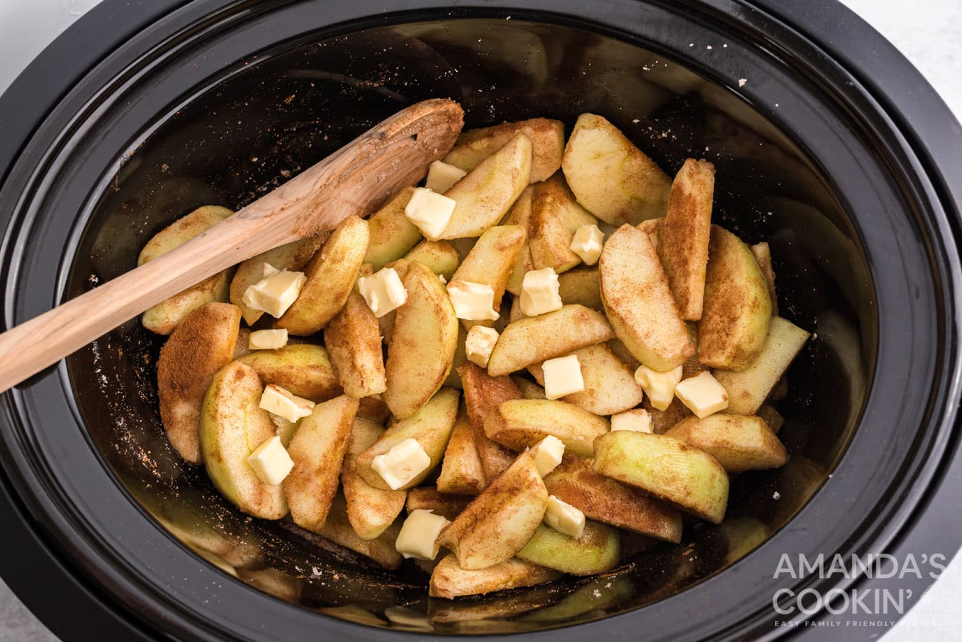 butter on top of cinnamon sugar apples