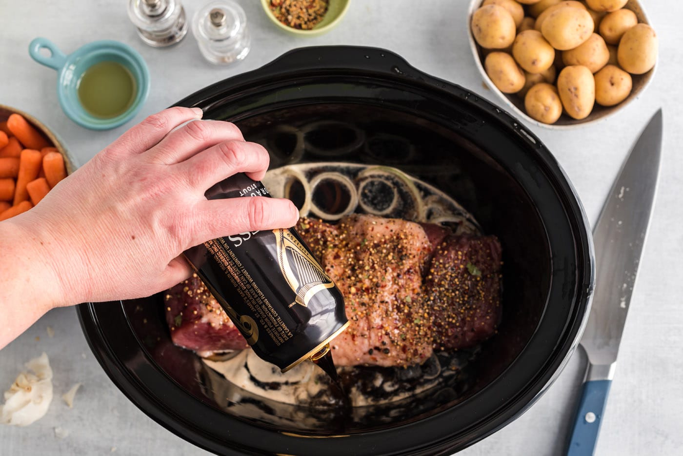 [ouring beer over crockpot corned beef