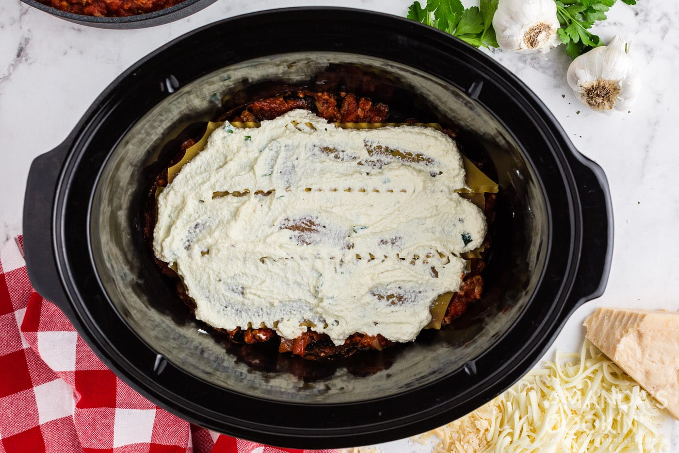 ricotta mixture on top of lasagna noodles
