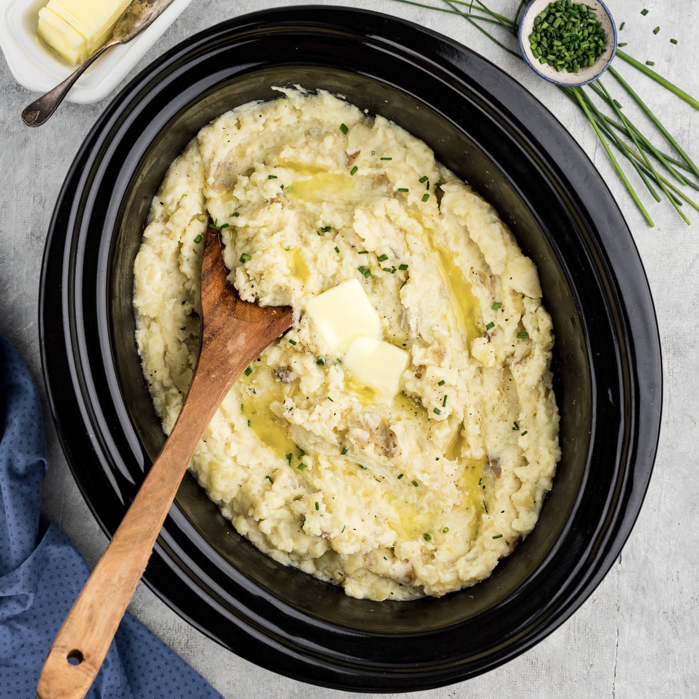 Overhead photo of Crockpot Mashed Potatoes with a spoon resting in it