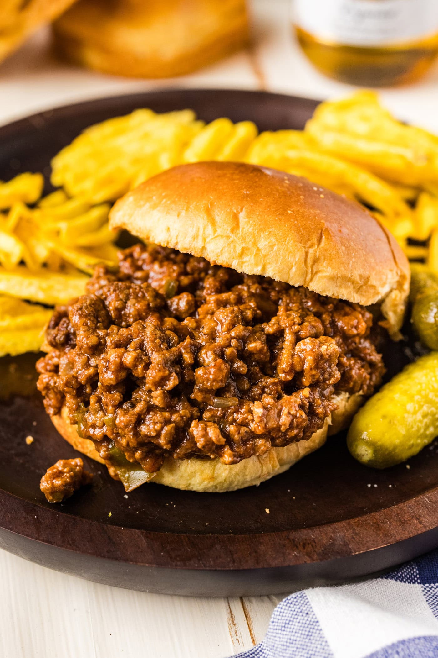 Bun sliding off a Crockpot Sloppy Joe sandwich