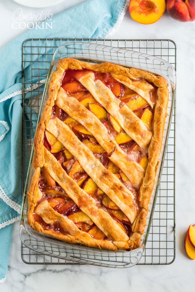 overhead view of peach pie on cooling rack