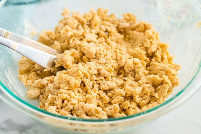 pie dough being mixed in bowl