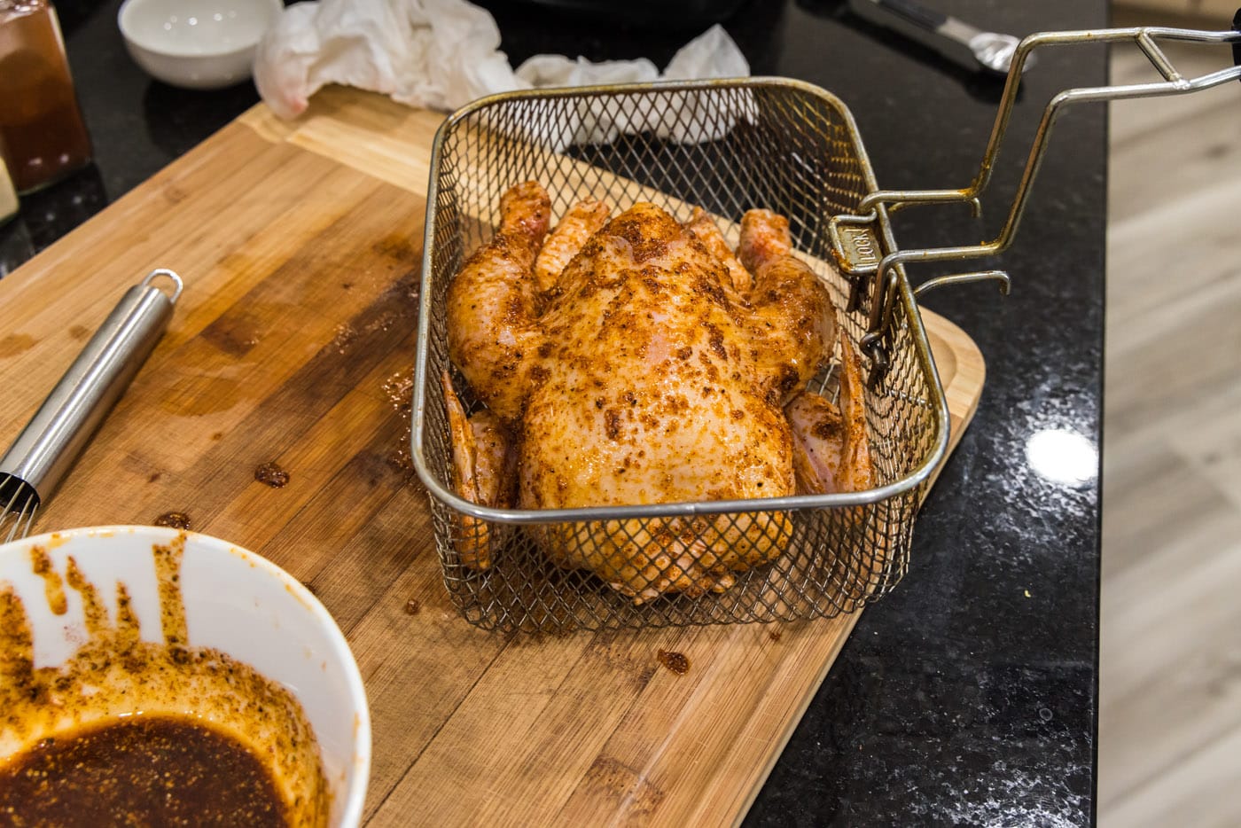 cornish hen in a deep fryer basket
