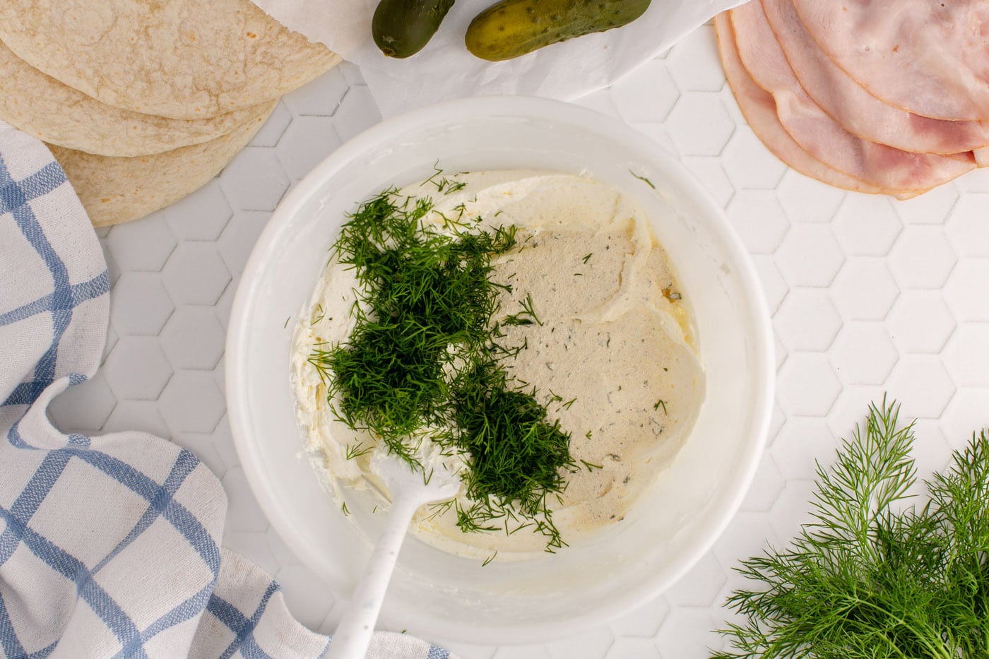 fresh dill added to cream cheese