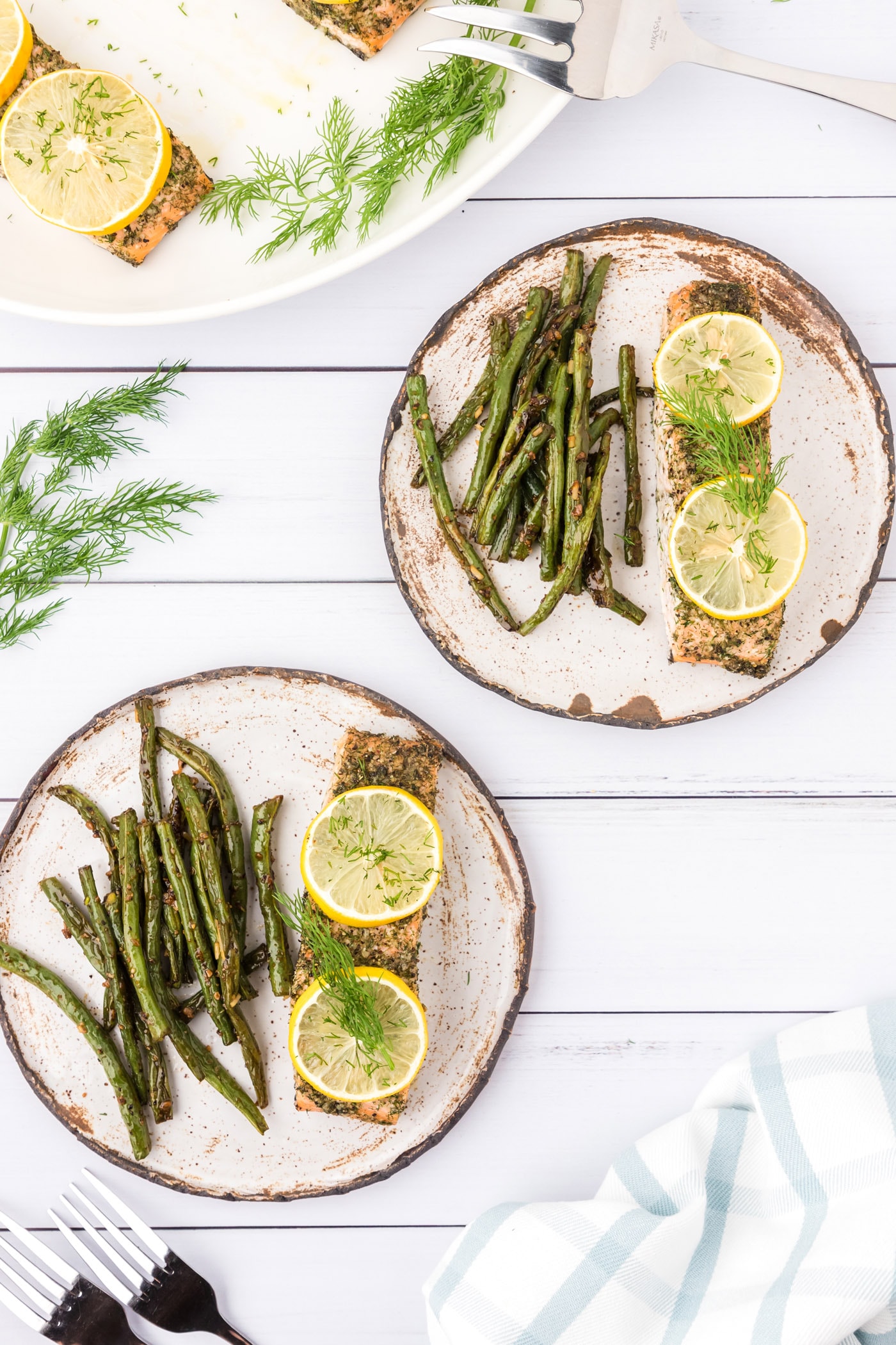Two plates of Dill Salmon and green beans