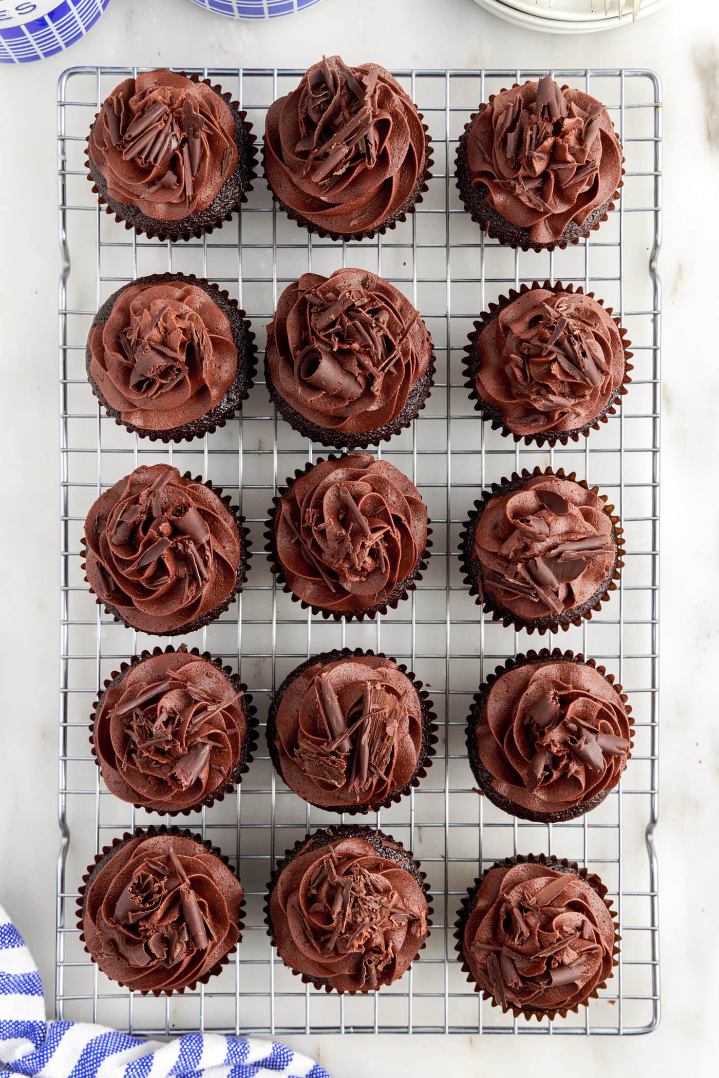Frosted Double Chocolate Cupcakes on a wire cooling rack