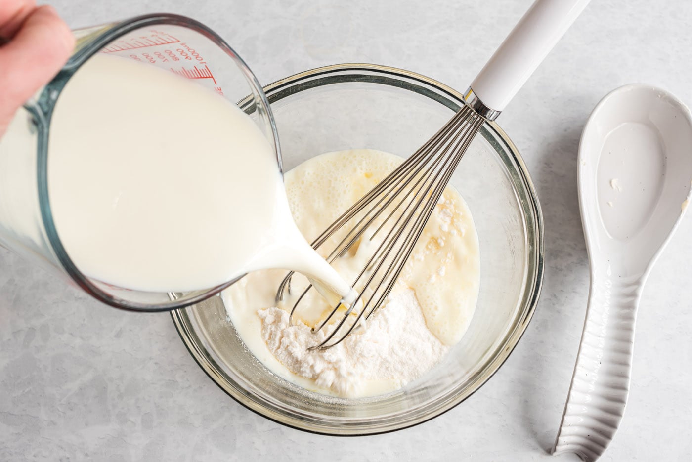 milk and instant vanilla pudding in a bowl