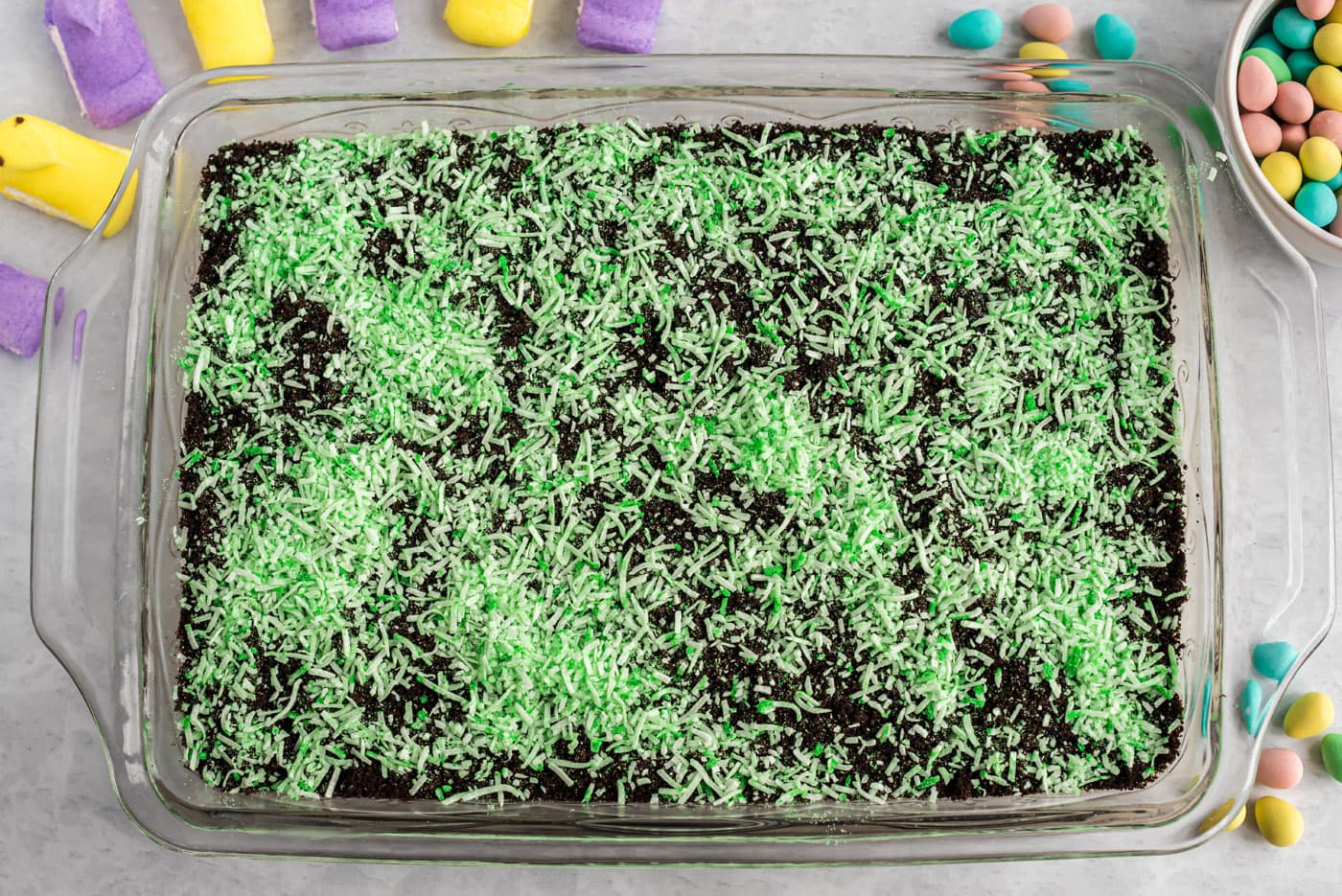 shredded coconut on top of easter dirt cake